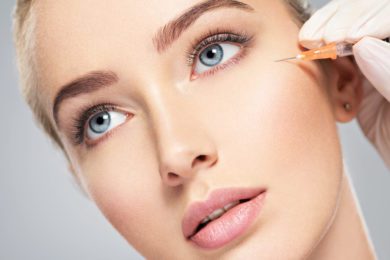 Woman getting cosmetic injection of botox near eyes Botox in NJ